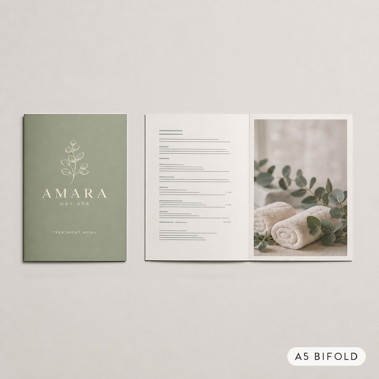 Closed sage green brochure with a botanical sprig beside the same brochure opened to grey text and white towels with eucalyptus on pale grey.