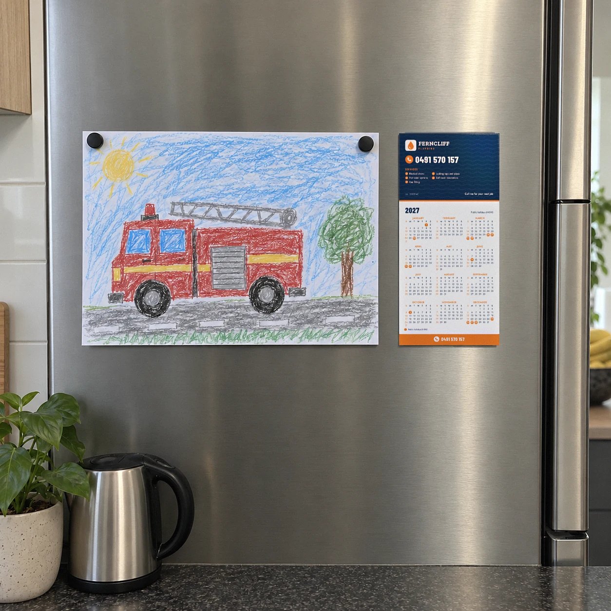 DL fridge magnet calendar in Tradie layout on stainless steel fridge door beside crayon drawing of red fire truck