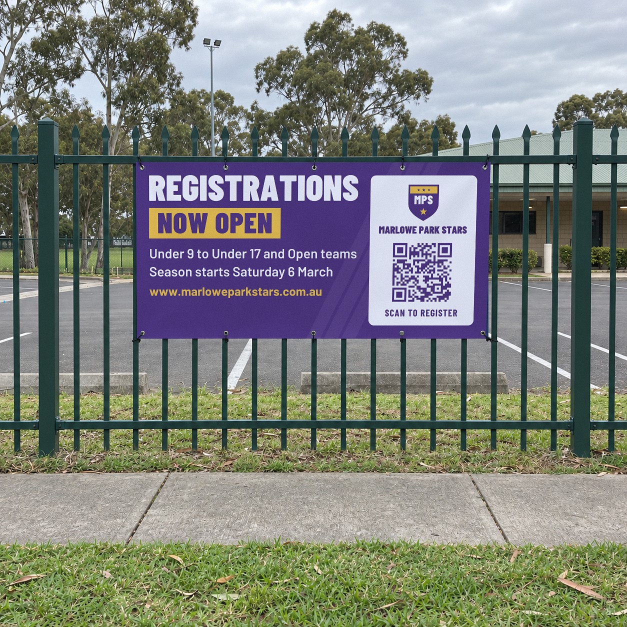 Purple vinyl registrations banner, 2000 x 1000mm, fixed with eyelets to a dark green steel palisade fence beside a car park