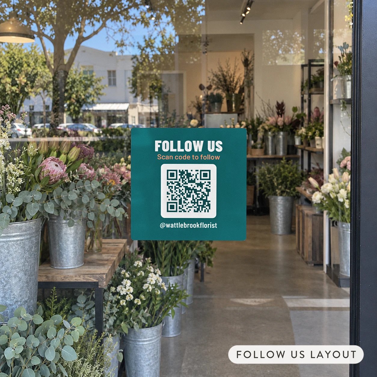 120mm square teal and coral QR code sticker with FOLLOW US and Scan code to follow on the glass front door of a florist shop
